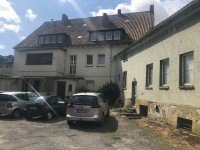 Bild (0d2cfbaf5e331158f69ca557953233e8): Mehrfamilienhaus und Garagenhof