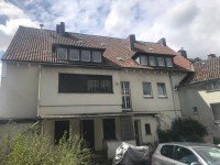 Bild (1d81fdfe9f3b8322ba7e79fa24f5554a): Mehrfamilienhaus und Garagenhof